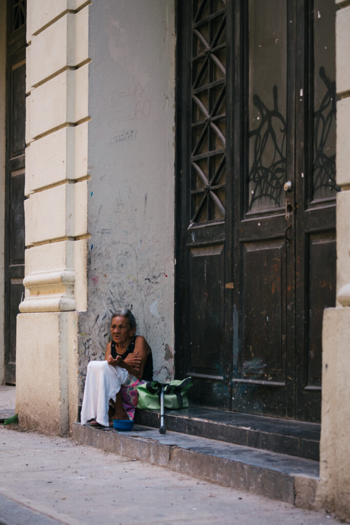 A woman sitting in a doorway in Havana, Cuba.