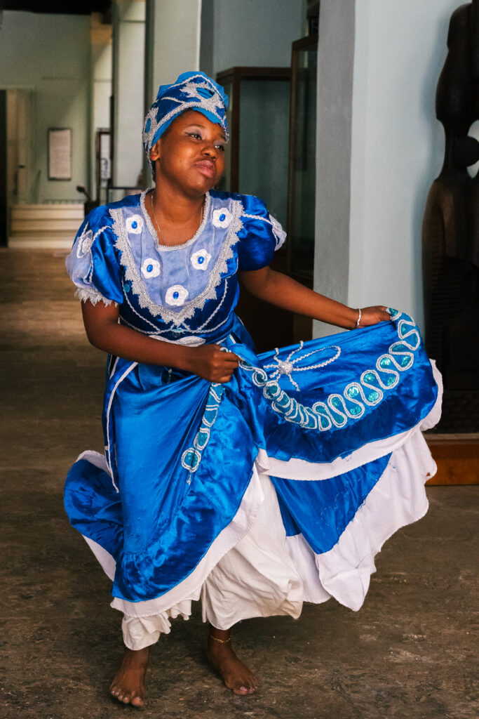 Woman in blue dancing at Casa de Africa in Havana, Cuba.