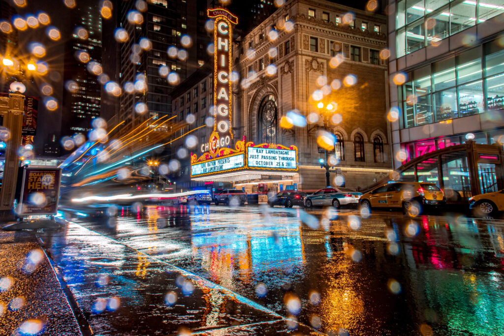 The Chicago Theater at night in the rain. 