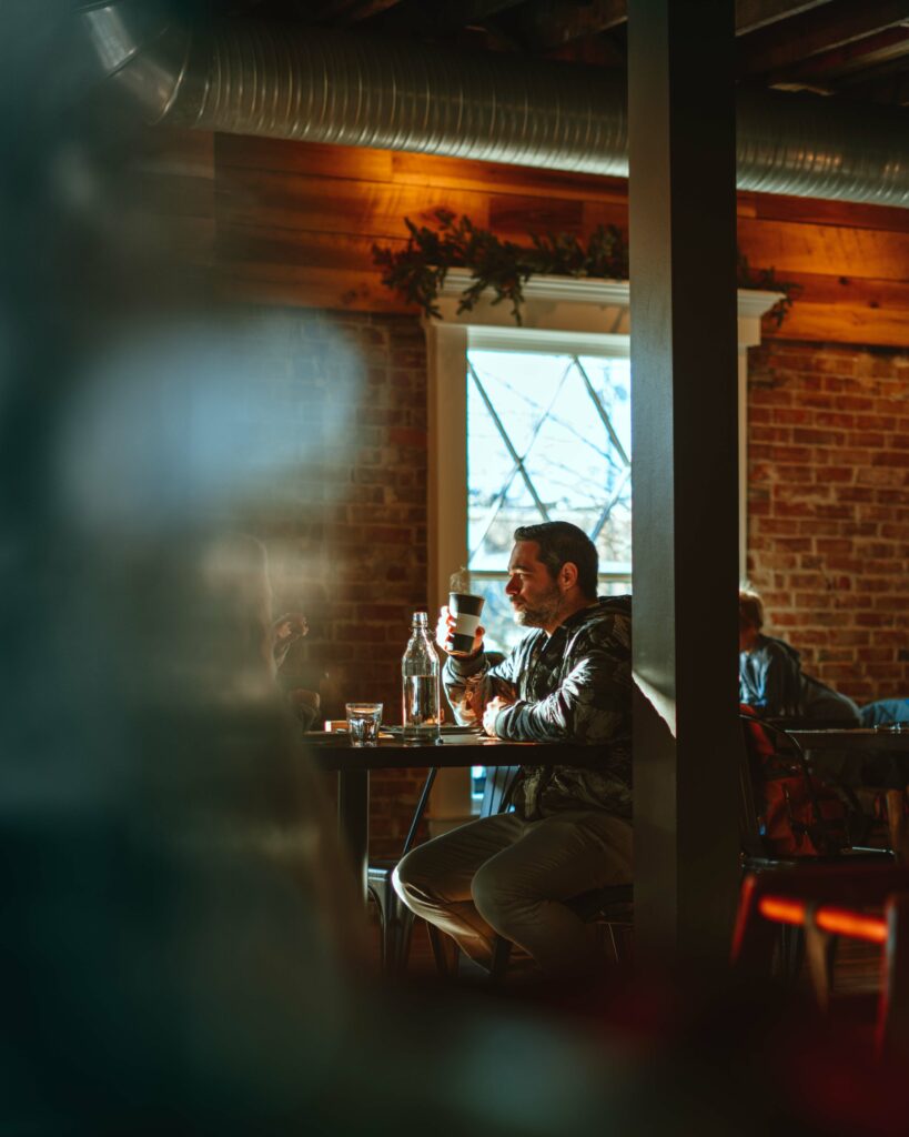 A candid photo of a man having coffee.